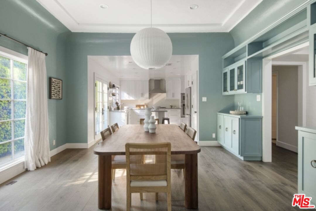 6607 Moore Drive Los Angeles, CA 90048 - Photo 10 of 42 a view of a dining room with furniture window and wooden floor