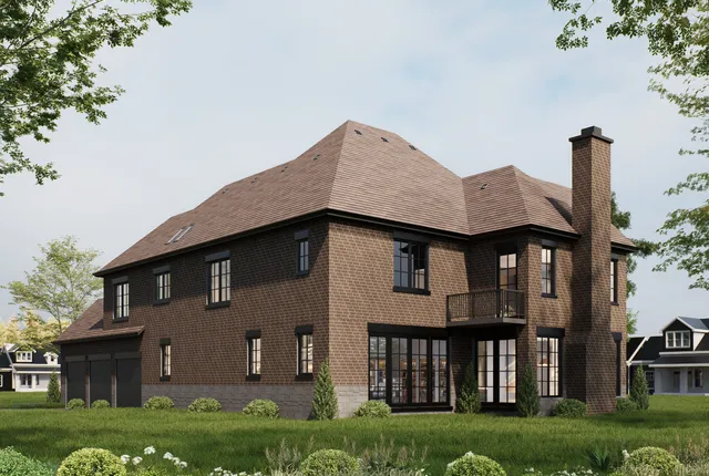 a front view of a house with a garden and plants