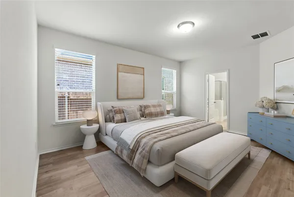 a bedroom with a bed and a dresser