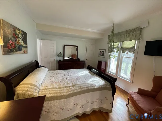 a bedroom with bed and window