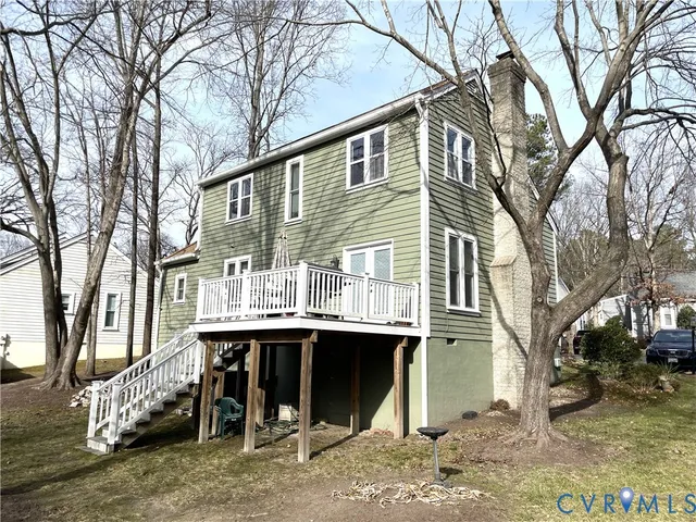 a front view of a house with a table and chairs