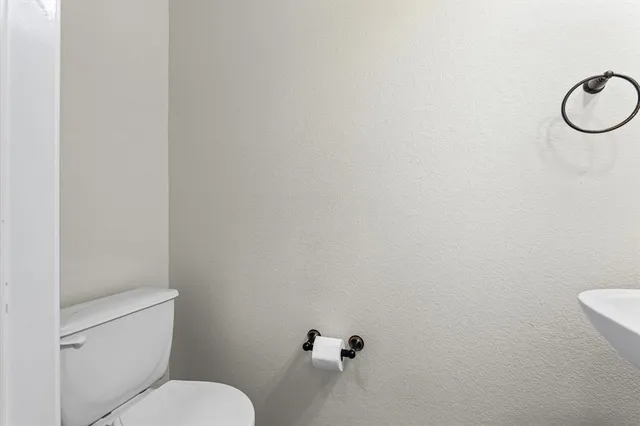 a bathroom with a sink a mirror and a window