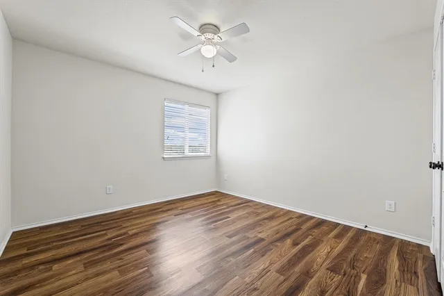 a bathroom with a double vanity sink toilet and shower