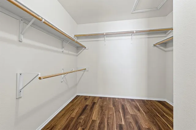 a bathroom with a bathtub shower and a sink