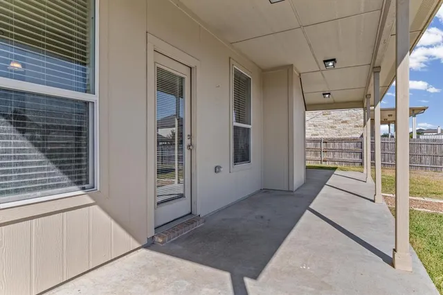 a view of a chairs and table in the patio