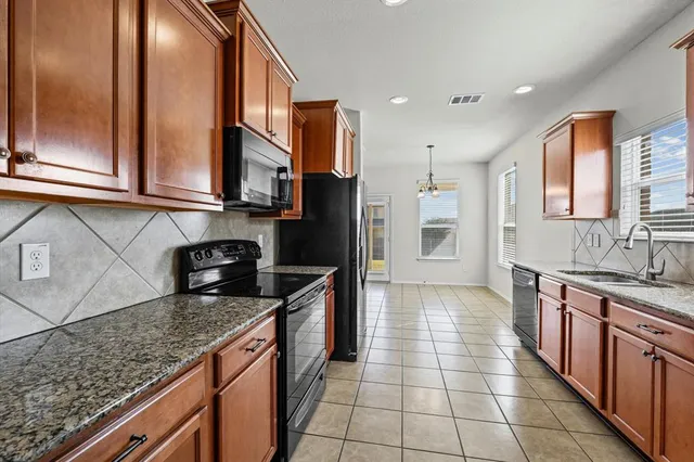 a view of a microwave and cabinets