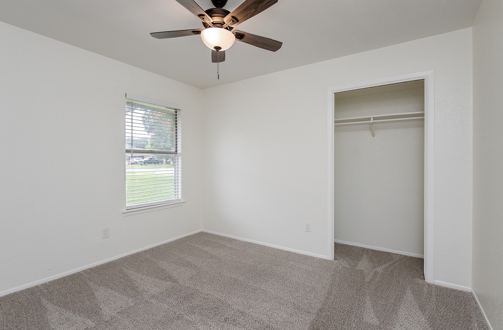 910 Garden View Drive Georgetown, TX 78628 - Photo 21 of 33 an empty room with windows and fan