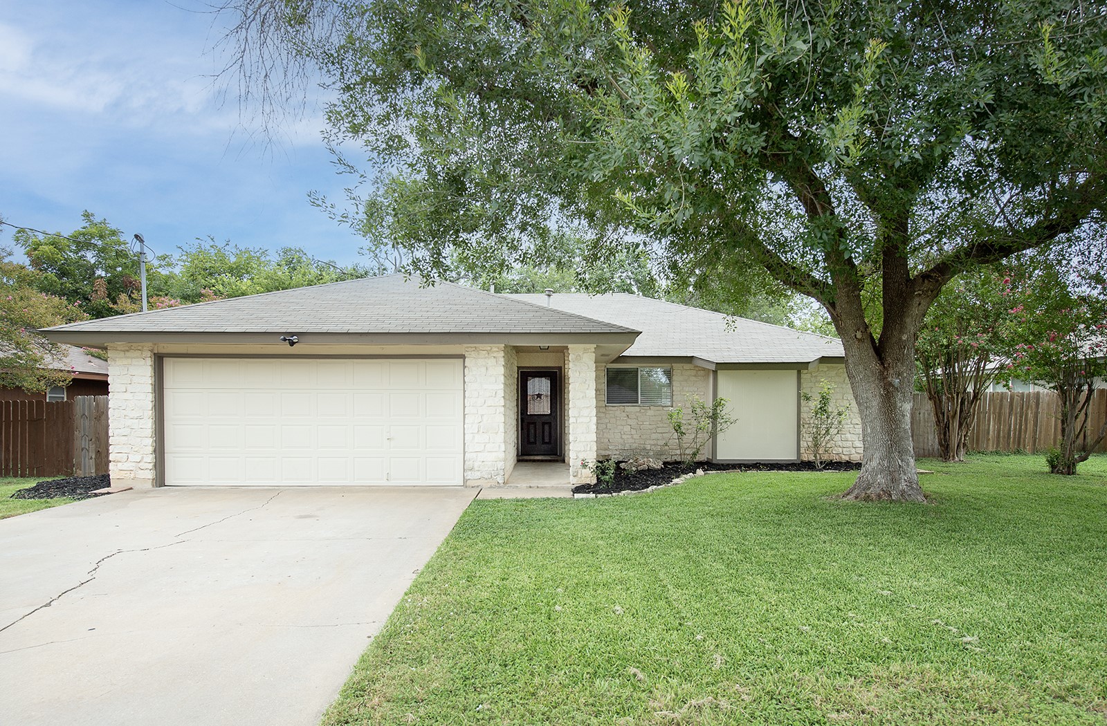 910 Garden View Drive Georgetown, TX 78628 - Photo 27 of 33 a front view of a house with a garden and yard
