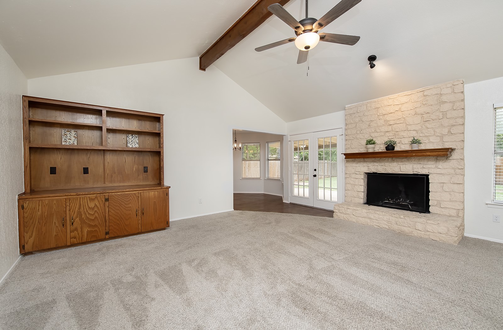 910 Garden View Drive Georgetown, TX 78628 - Photo 7 of 33 a view of an empty room with a fireplace and a window