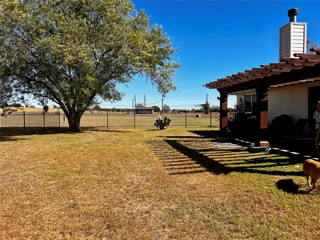 a swimming pool with outdoor seating