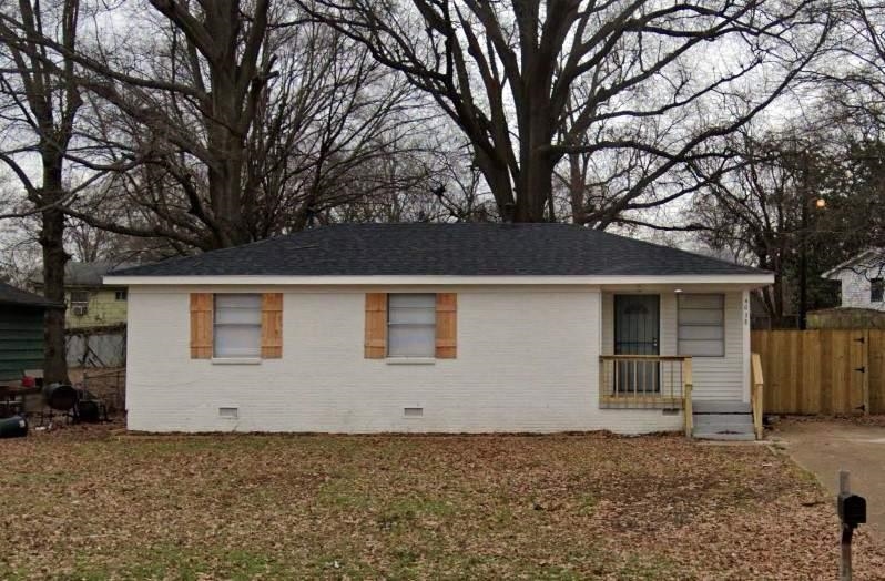 4638 Neely Road Memphis, TN 38109 - Photo 1 of 1 a front view of a house with a yard and garage