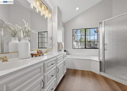 a room with wooden floor and furniture