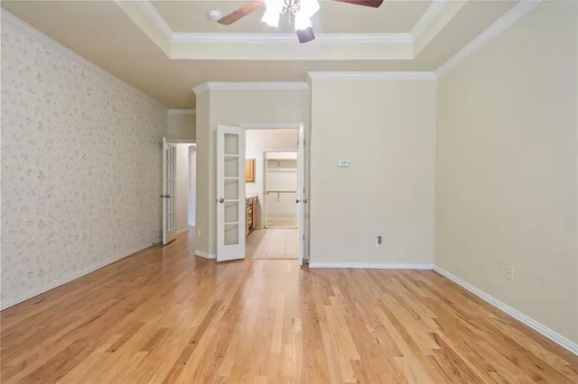 a bed room with a bed and a chair