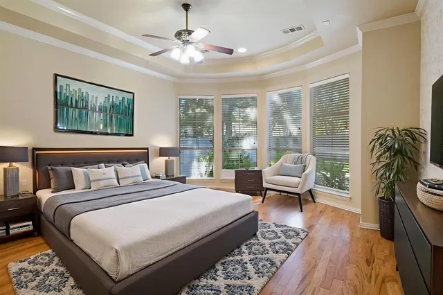 a spacious bathroom with a double vanity sink a large mirror and a shower