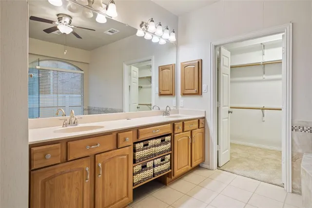 a bathroom with a tub and shower