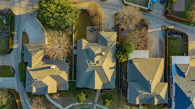 an aerial view of residential houses with outdoor space