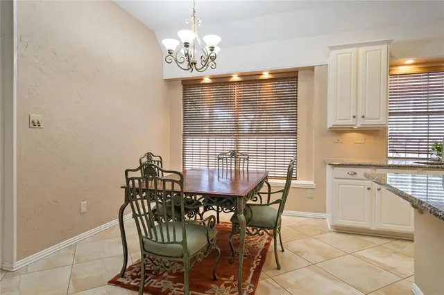 a view of empty room with wooden floor and fireplace