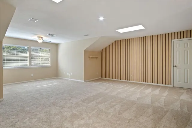 a view of a kitchen with workspace and a window