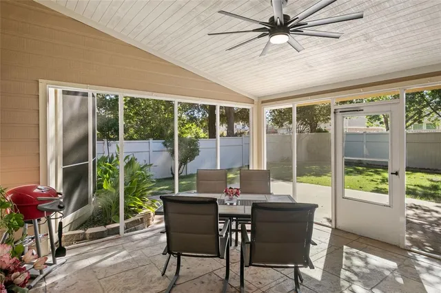 a living room with furniture and flowers