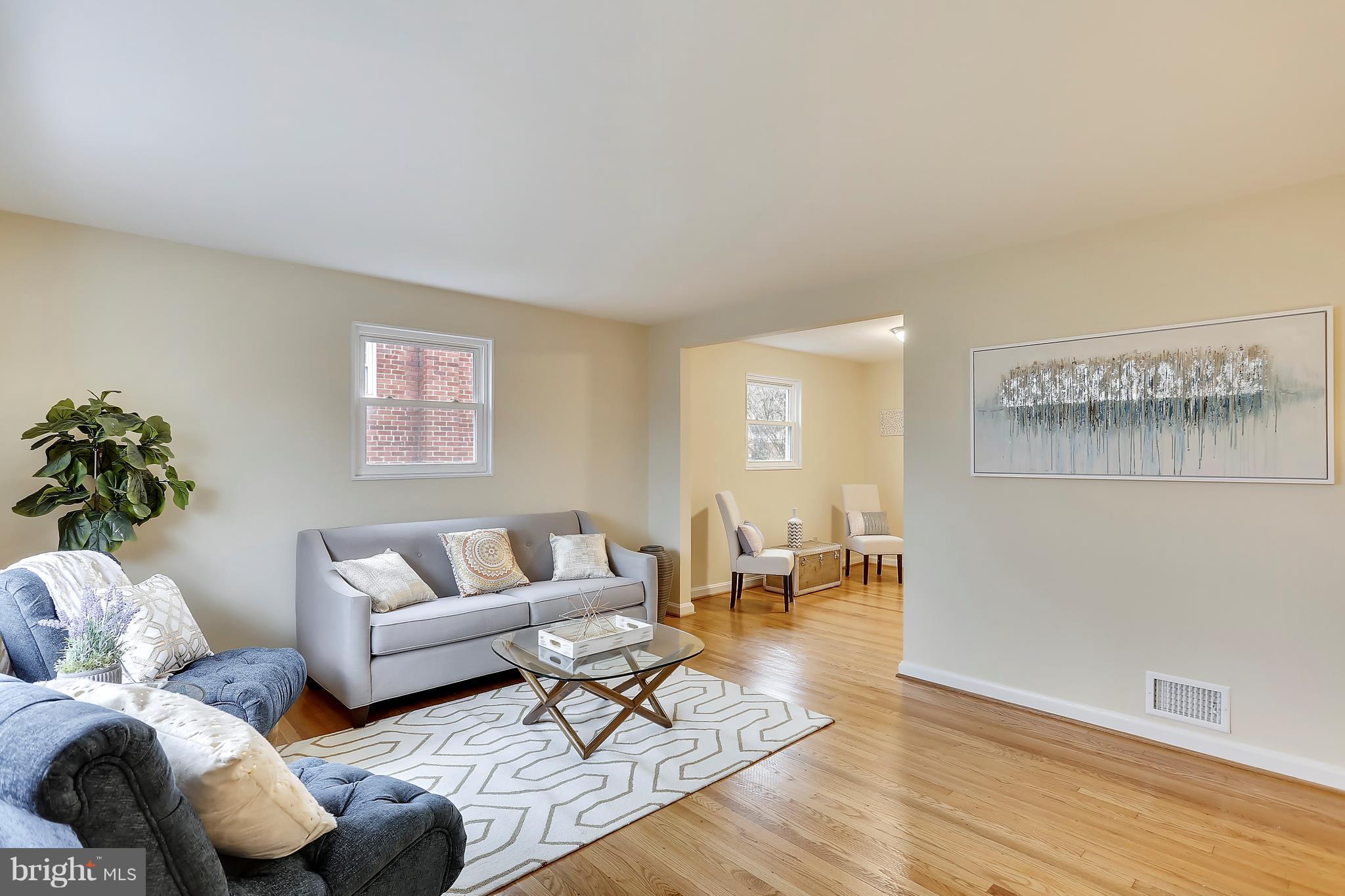 4717 Oxbow Road Rockville, MD 20852 - Photo 3 of 30 Spacious living room w/beautiful hardwood floors.
