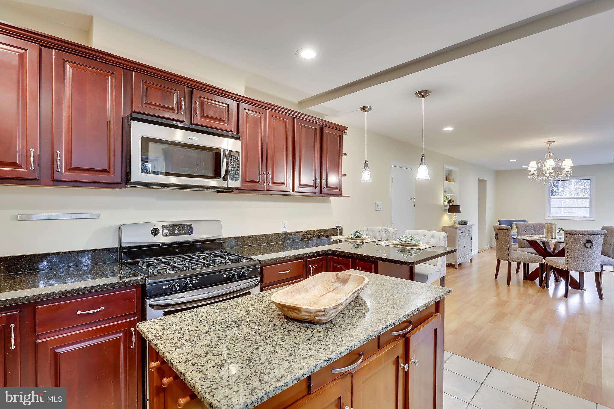 4717 Oxbow Road Rockville, MD 20852 - Photo 19 of 30 Granite counters and stainless appliances.