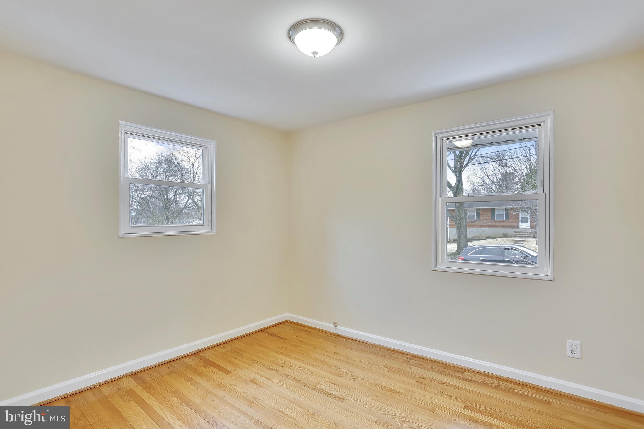 4717 Oxbow Road Rockville, MD 20852 - Photo 8 of 30 Bedroom two with hardwood floors.