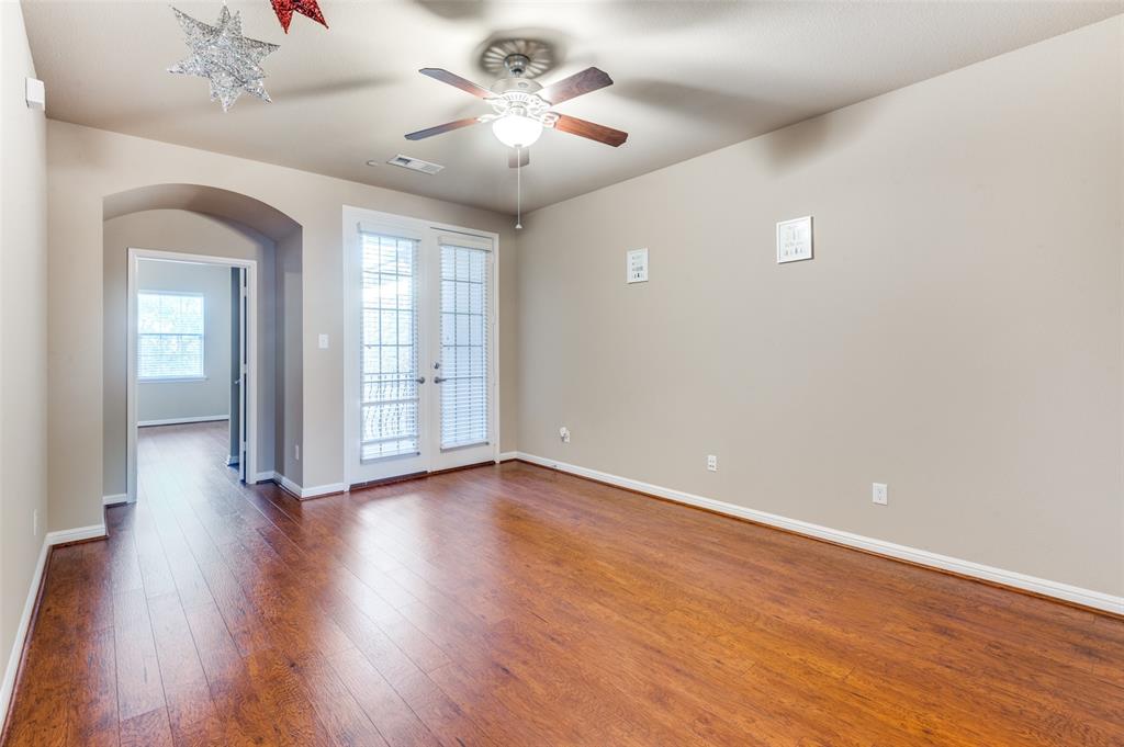 1915 Luther Road Irving, TX 75063 - Photo 13 of 25 wooden floor in an empty room with a window