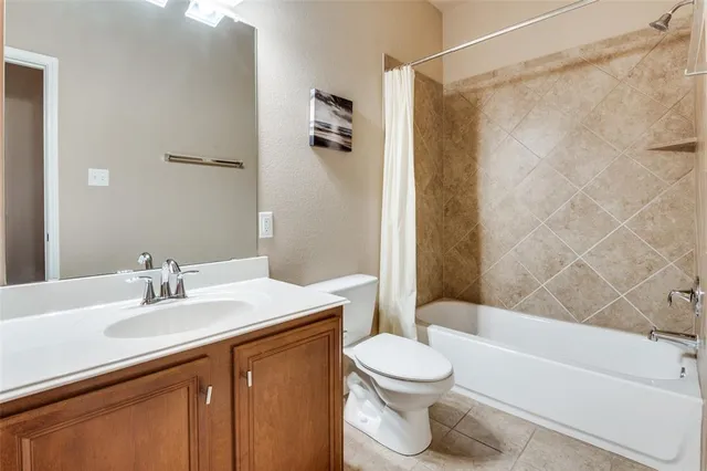 a bathroom with a sink a toilet and a bathtub