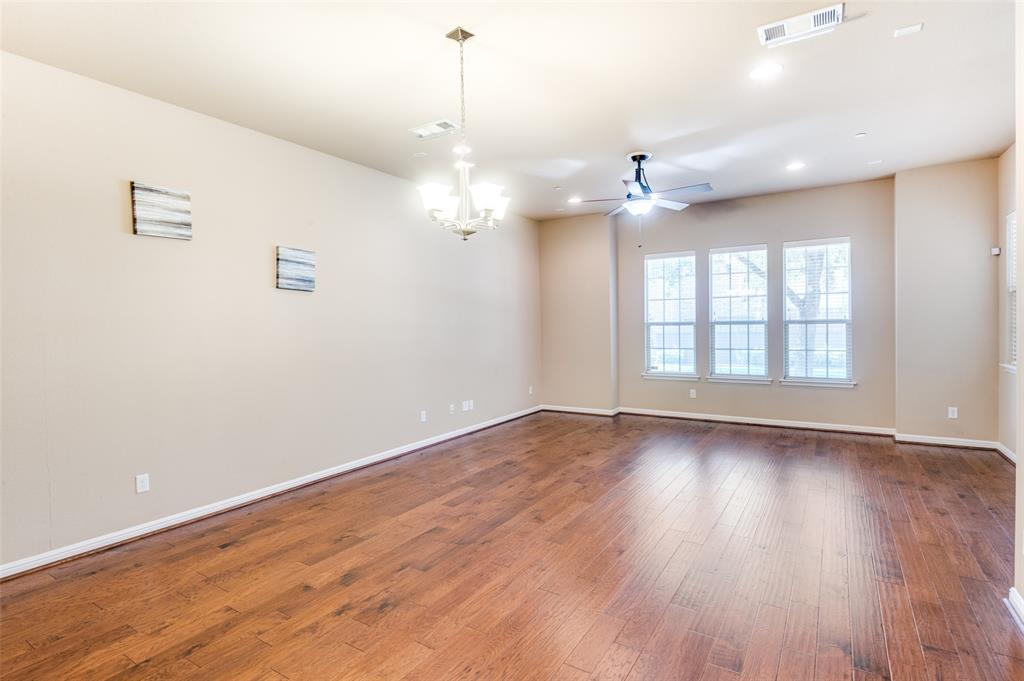 1915 Luther Road Irving, TX 75063 - Photo 3 of 25 a view of an empty room with wooden floor and a window