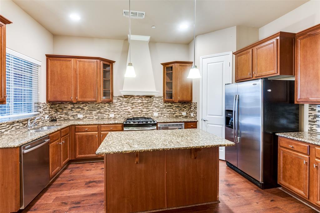 1915 Luther Road Irving, TX 75063 - Photo 9 of 25 a kitchen with stainless steel appliances granite countertop a refrigerator a sink and dishwasher
