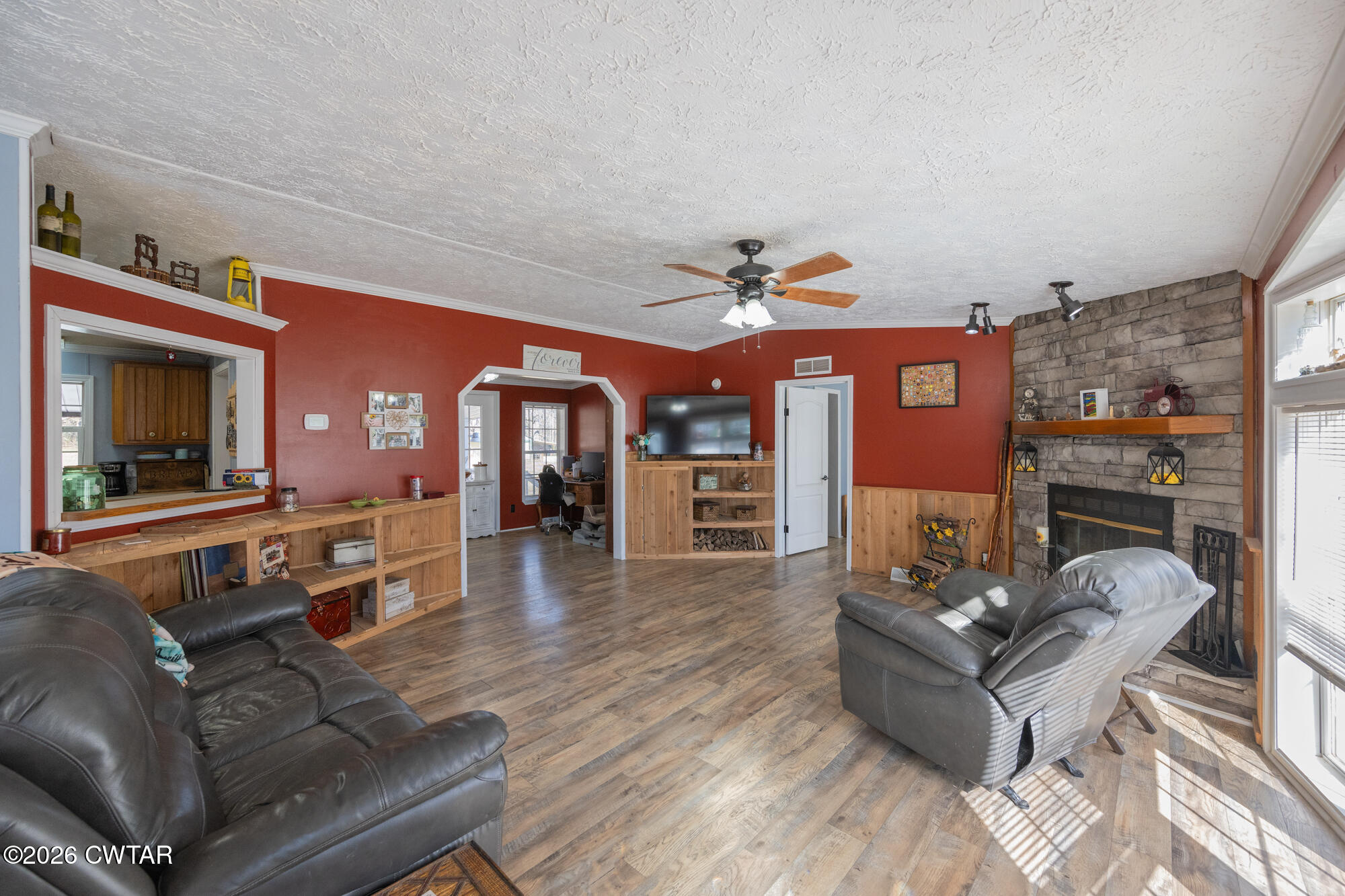 419 Hughes Road East Jackson, TN 38305 - Photo 12 of 39 a living room with furniture and a fireplace