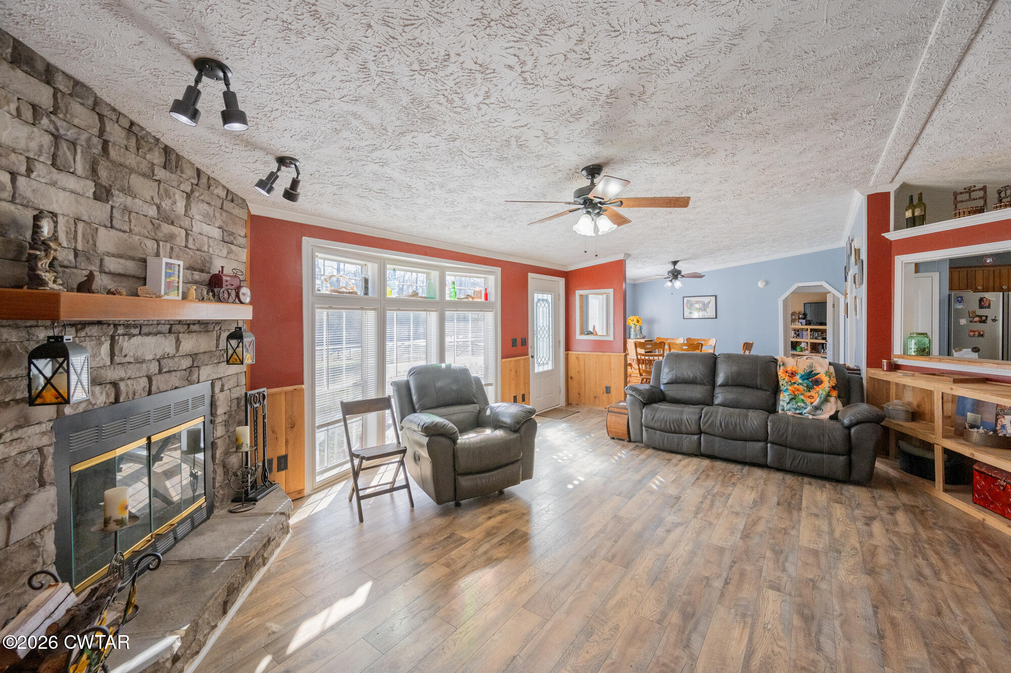 419 Hughes Road East Jackson, TN 38305 - Photo 14 of 39 a living room with furniture and a floor to ceiling window