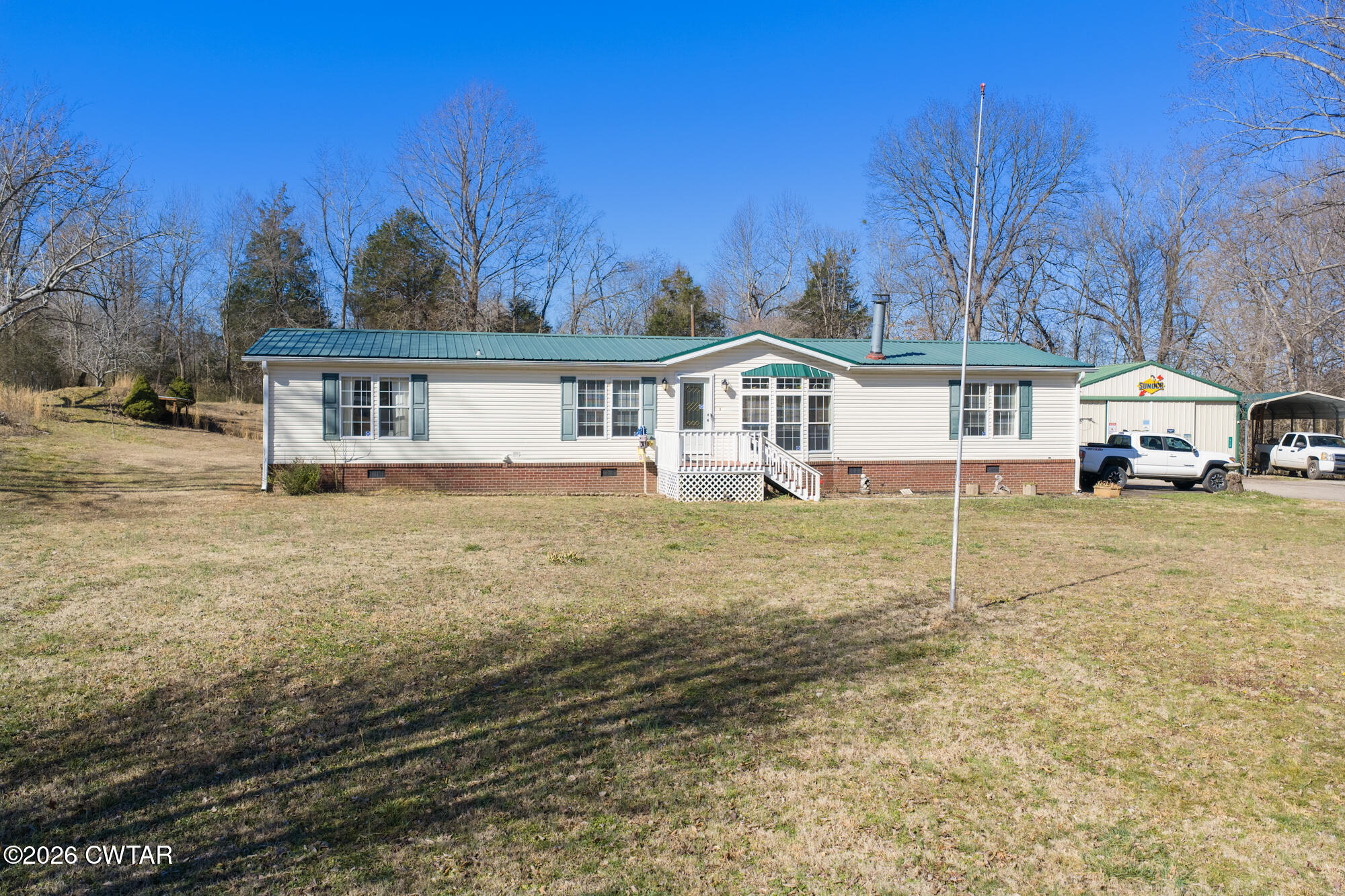 419 Hughes Road East Jackson, TN 38305 - Photo 2 of 39 a front view of a house with a yard