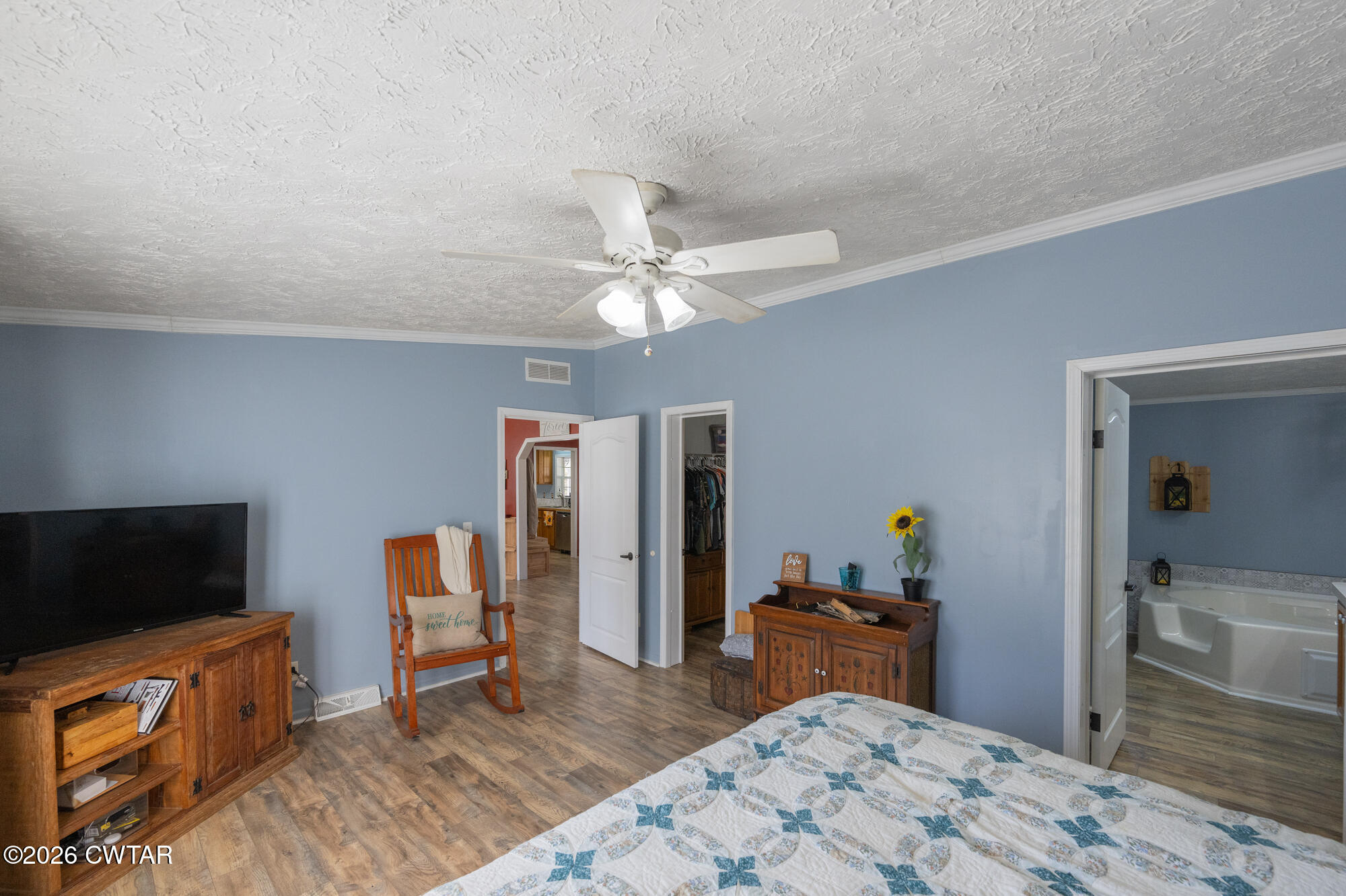 419 Hughes Road East Jackson, TN 38305 - Photo 22 of 39 a bedroom with furniture and a flat screen tv