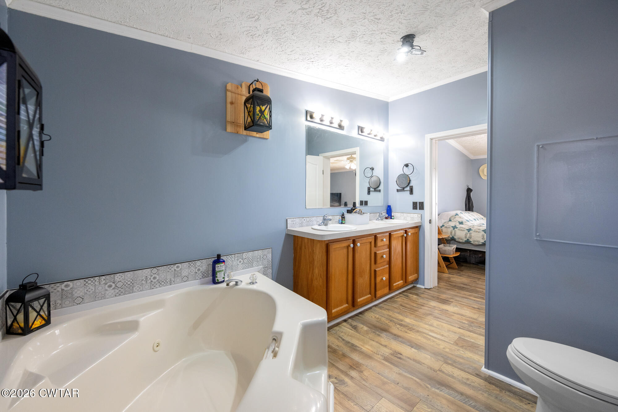 419 Hughes Road East Jackson, TN 38305 - Photo 24 of 39 a en suite bathroom with a double vanity sink and a mirror