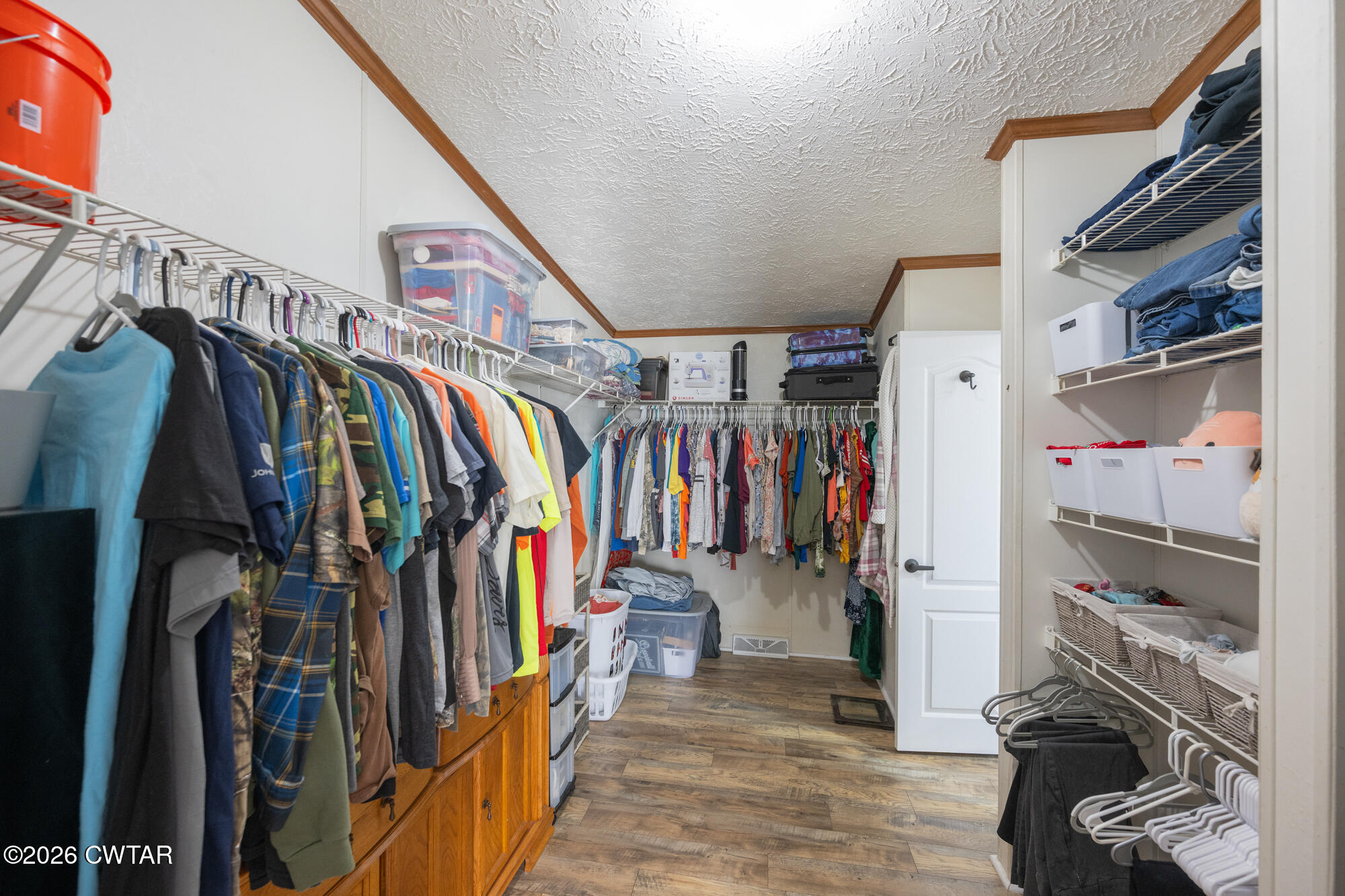 419 Hughes Road East Jackson, TN 38305 - Photo 25 of 39 a view of walk in closet with clothes and shoes