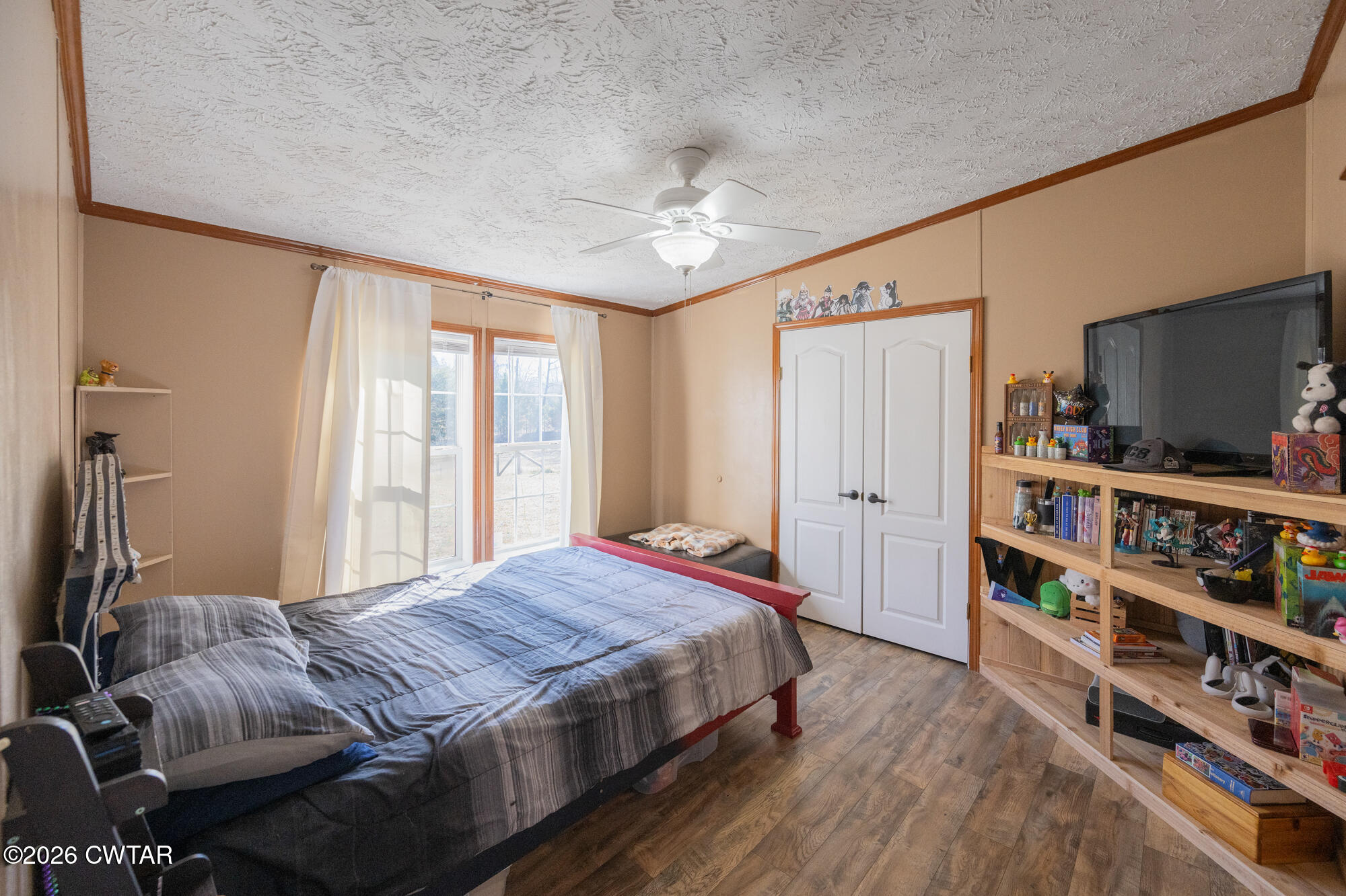419 Hughes Road East Jackson, TN 38305 - Photo 26 of 39 a bedroom with a bed furniture and a large window