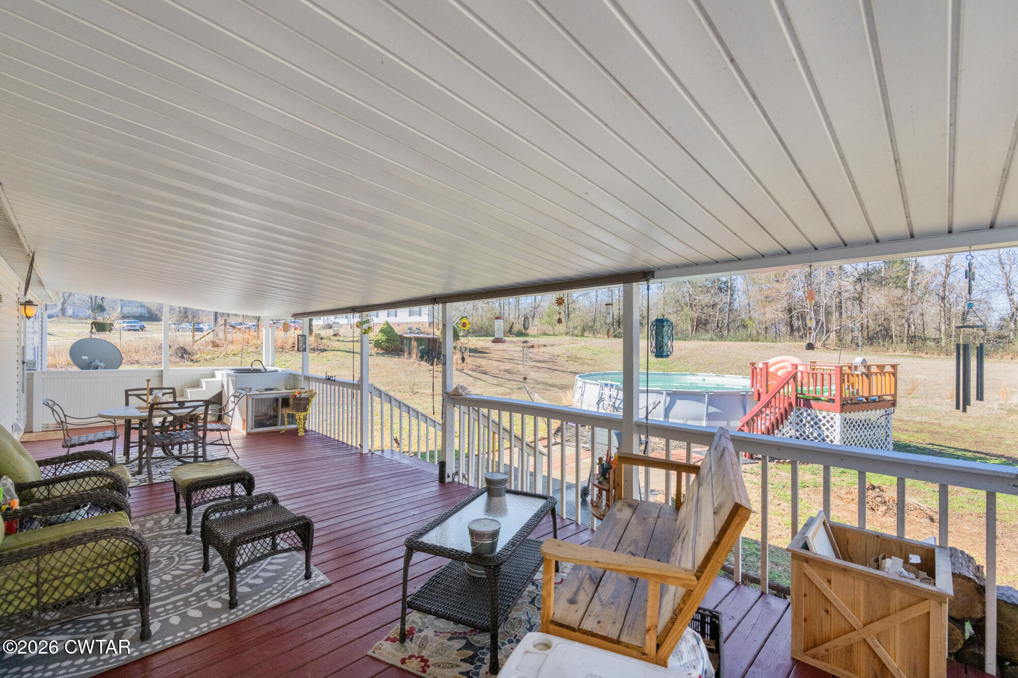 419 Hughes Road East Jackson, TN 38305 - Photo 31 of 39 a living room with furniture and a floor to ceiling window
