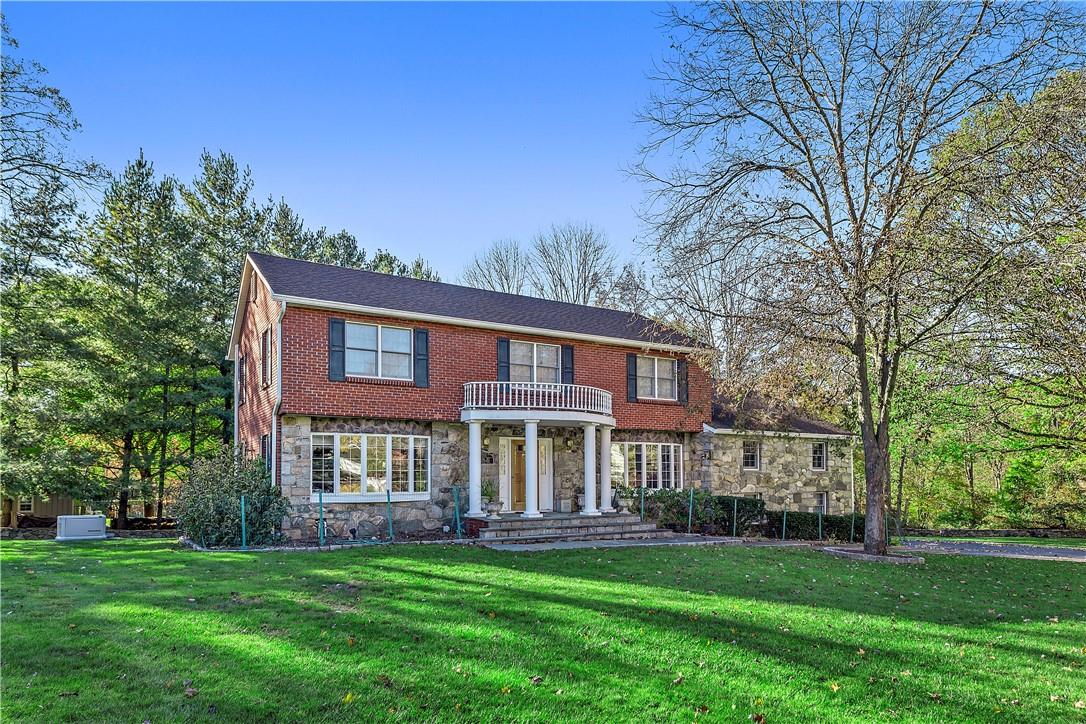 a view of an apartment with a garden and entertaining space