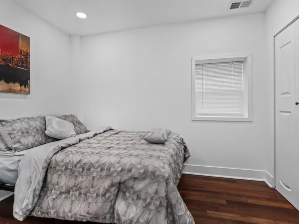 a bedroom with two beds and a window
