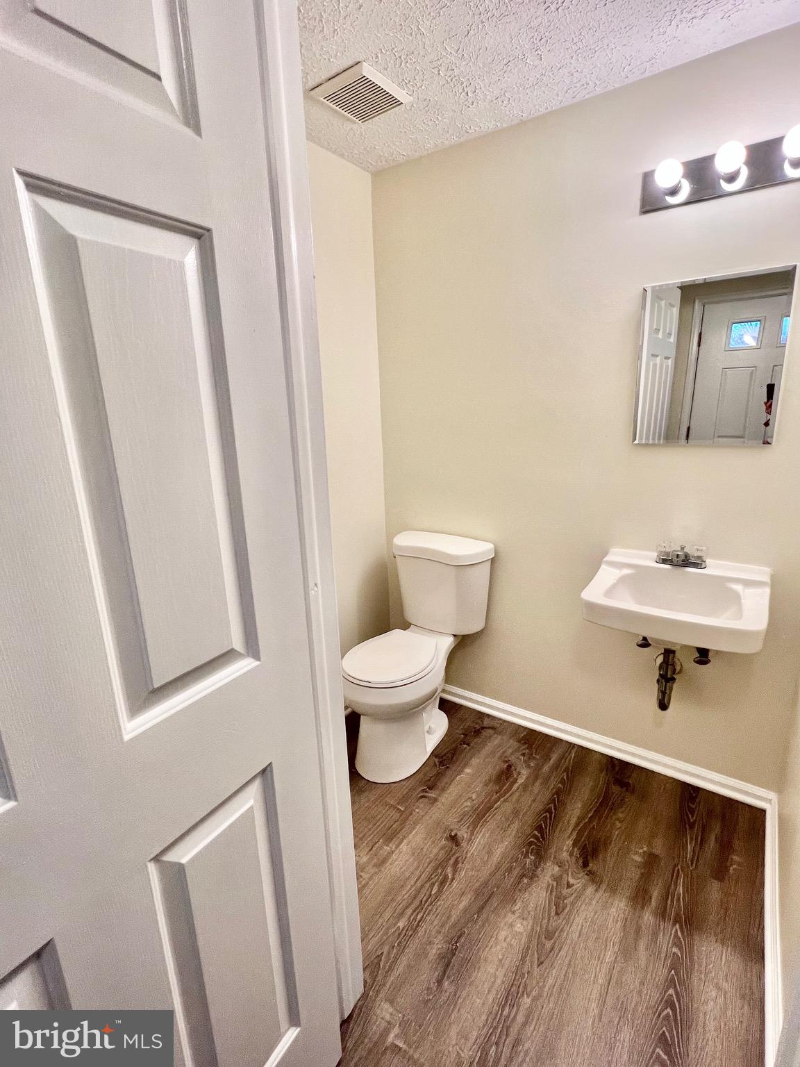 10129 Shelldrake Circle Damascus, MD 20872 - Photo 7 of 39 a bathroom with a toilet and a sink