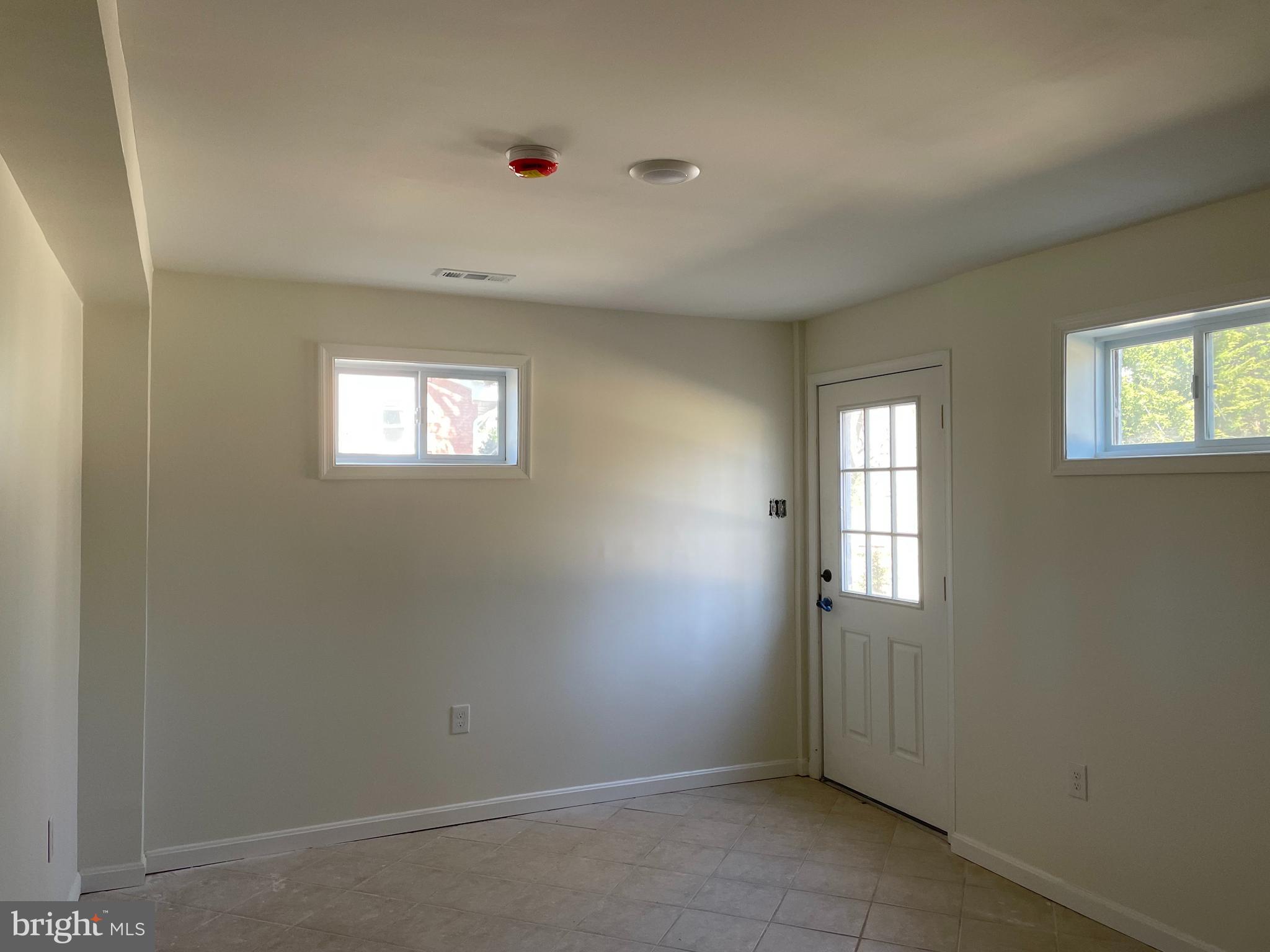 8018 Sinclair Mill Road Manassas, VA 20112 - Photo 4 of 10 an empty room with windows