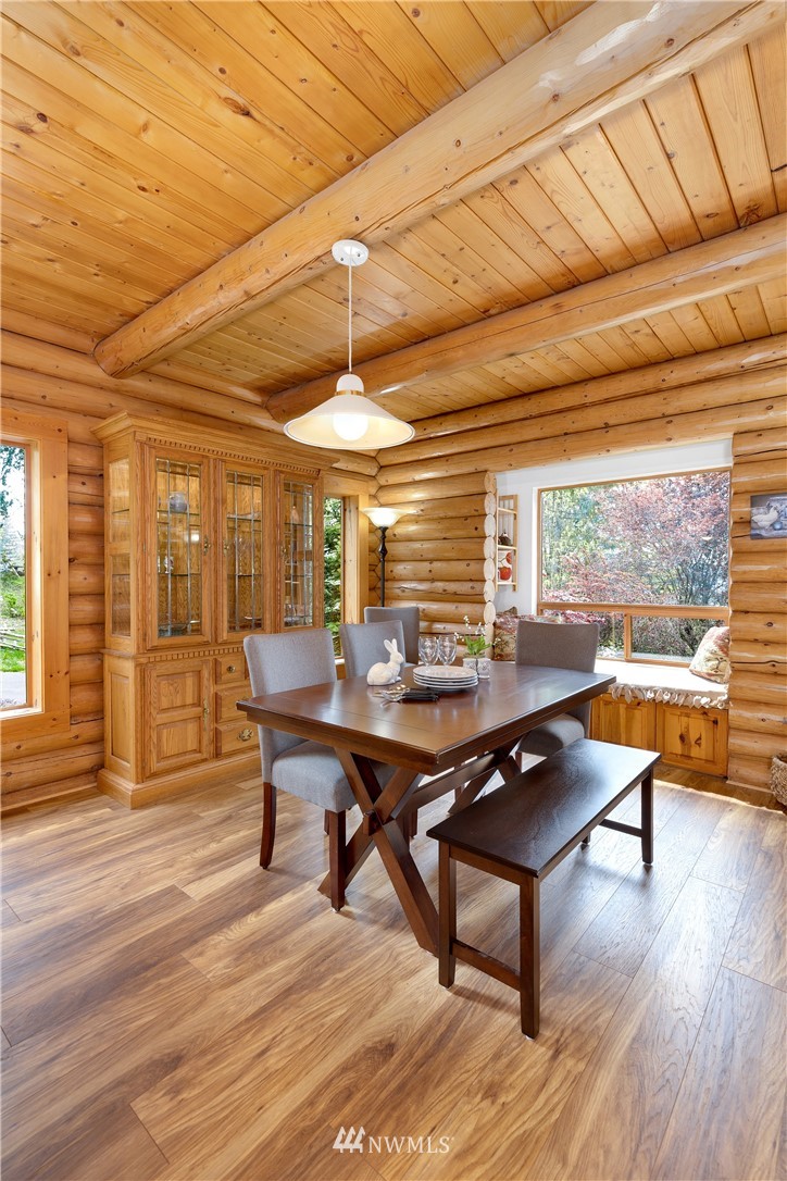 29129 Reiner Road Monroe, WA 98272 - Photo 14 of 39 a view of a dining room with furniture window and wooden floor