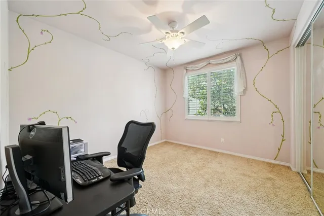 a view of a workspace with furniture