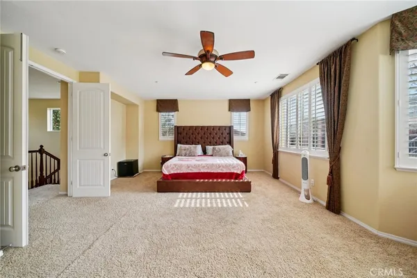 a living room with furniture a rug and a fireplace