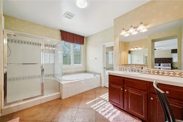 a bathroom with a double vanity sink and a mirror
