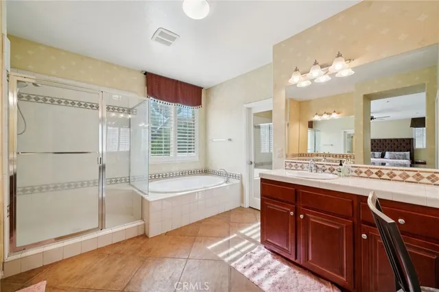 a bathroom with a double vanity sink and a mirror
