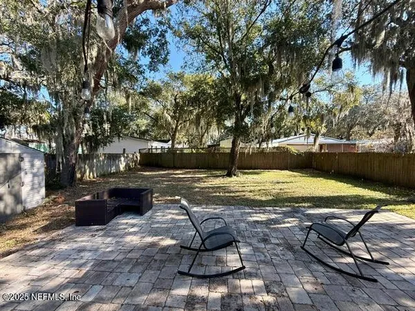 a view of swimming pool with lounge chair