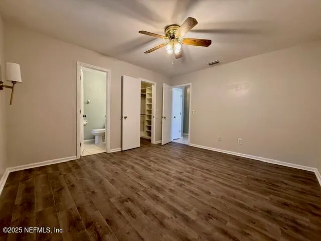 a bathroom with a sink a toilet and vanity