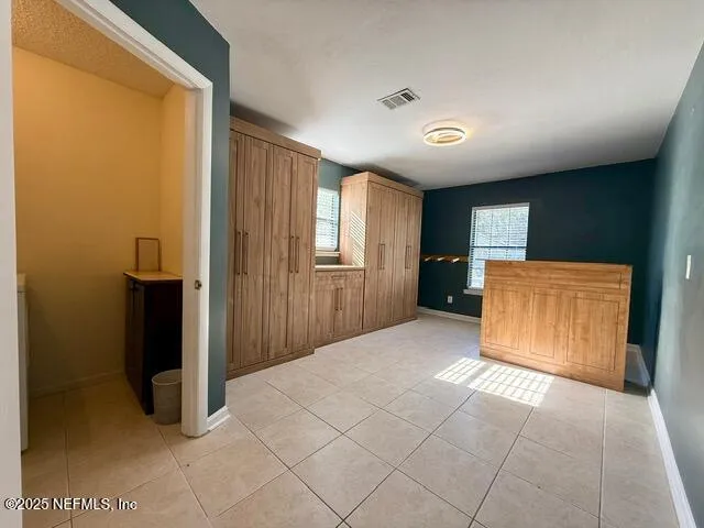 a view of an empty room with a window